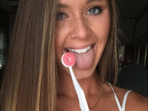 Cute girl showing a clean tongue