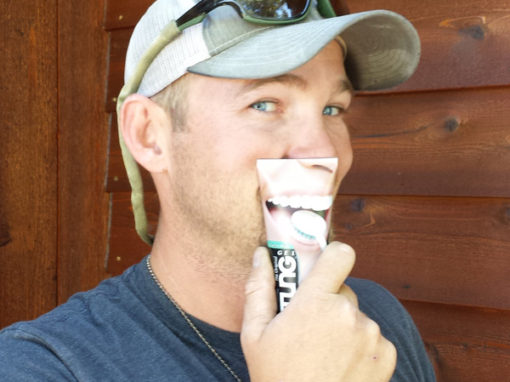 Man holding TUNG gel tube up